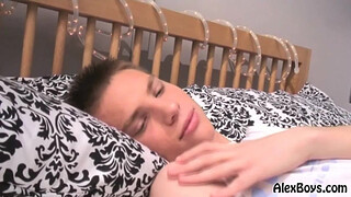 Худенький пацан ласкает соски и дрочит розовый член правой рукой